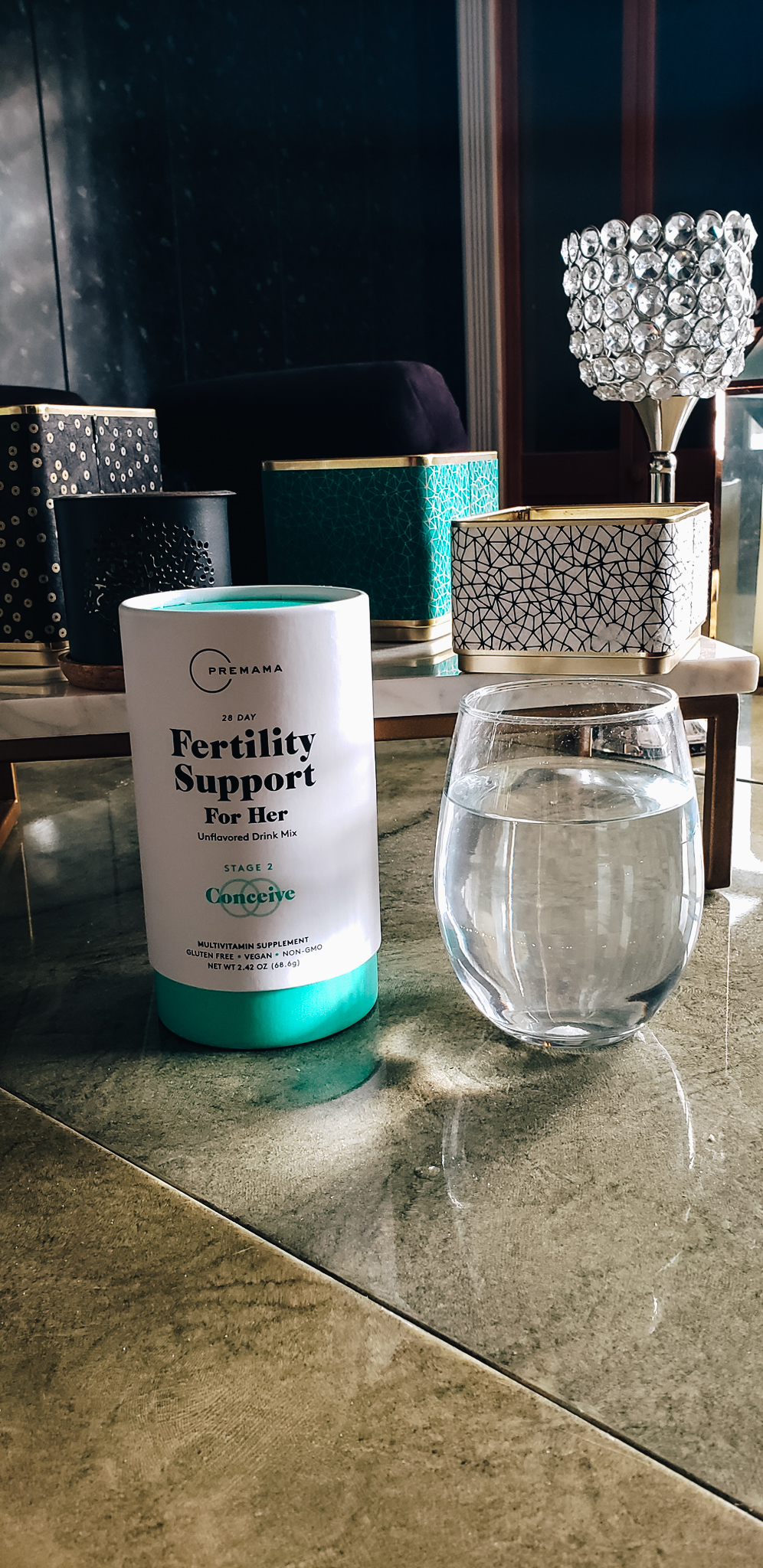 Premama Wellness Fertility Support with a glass of water