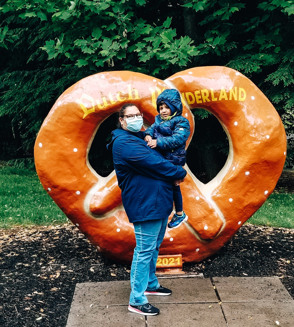 Me and my son in front of Dutch Wonderland Pretzel Statue