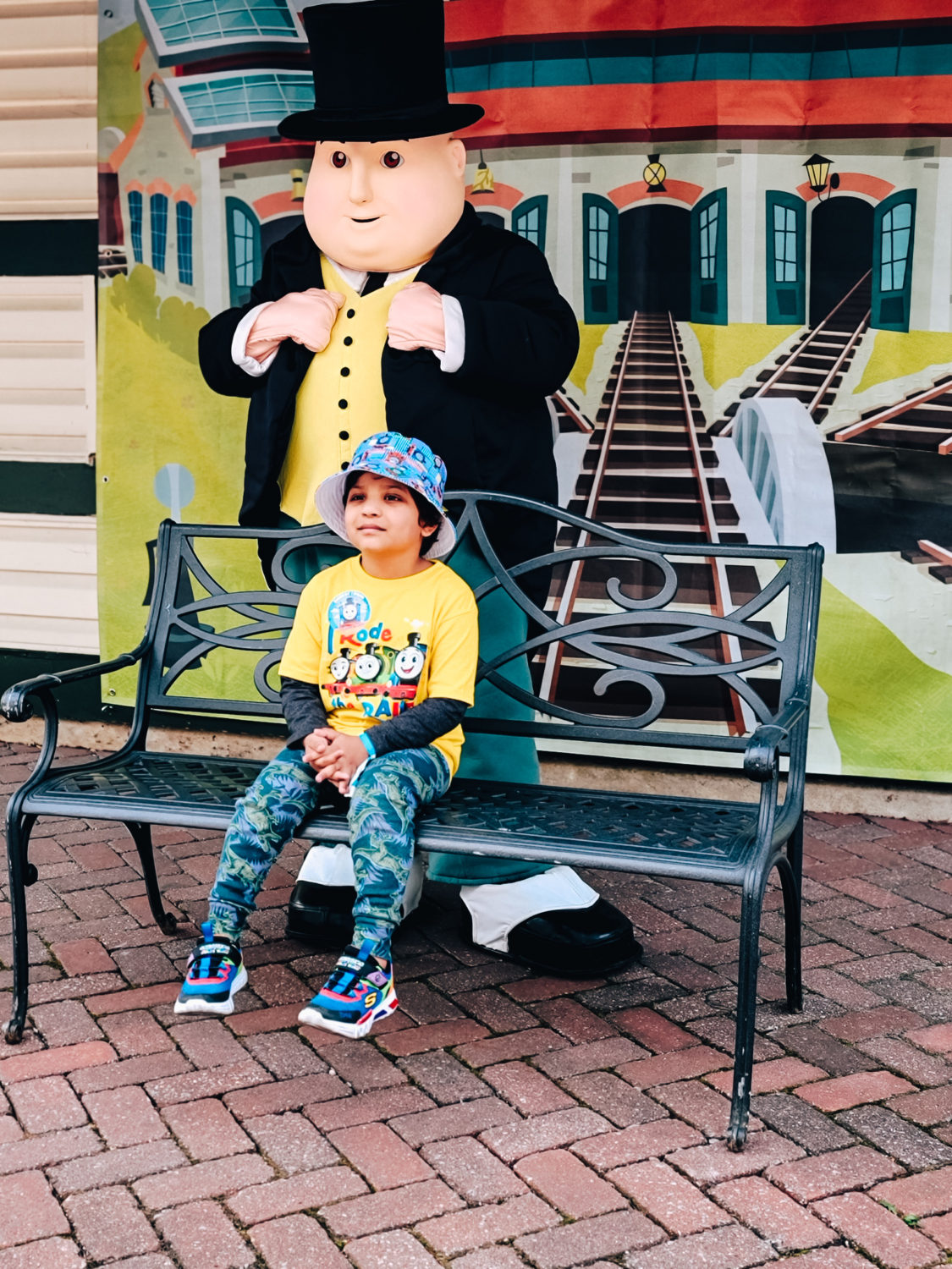 My son taking a picture with Sir Topham Hatt