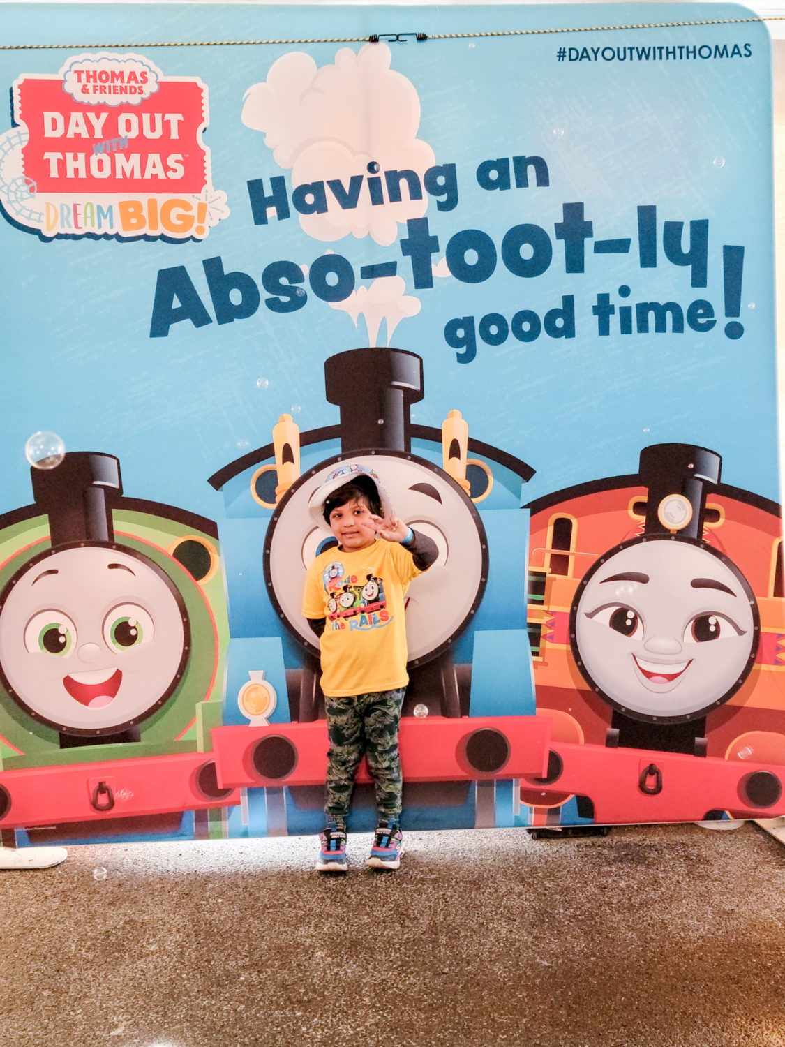 Picture in front of poster for thomas and friends