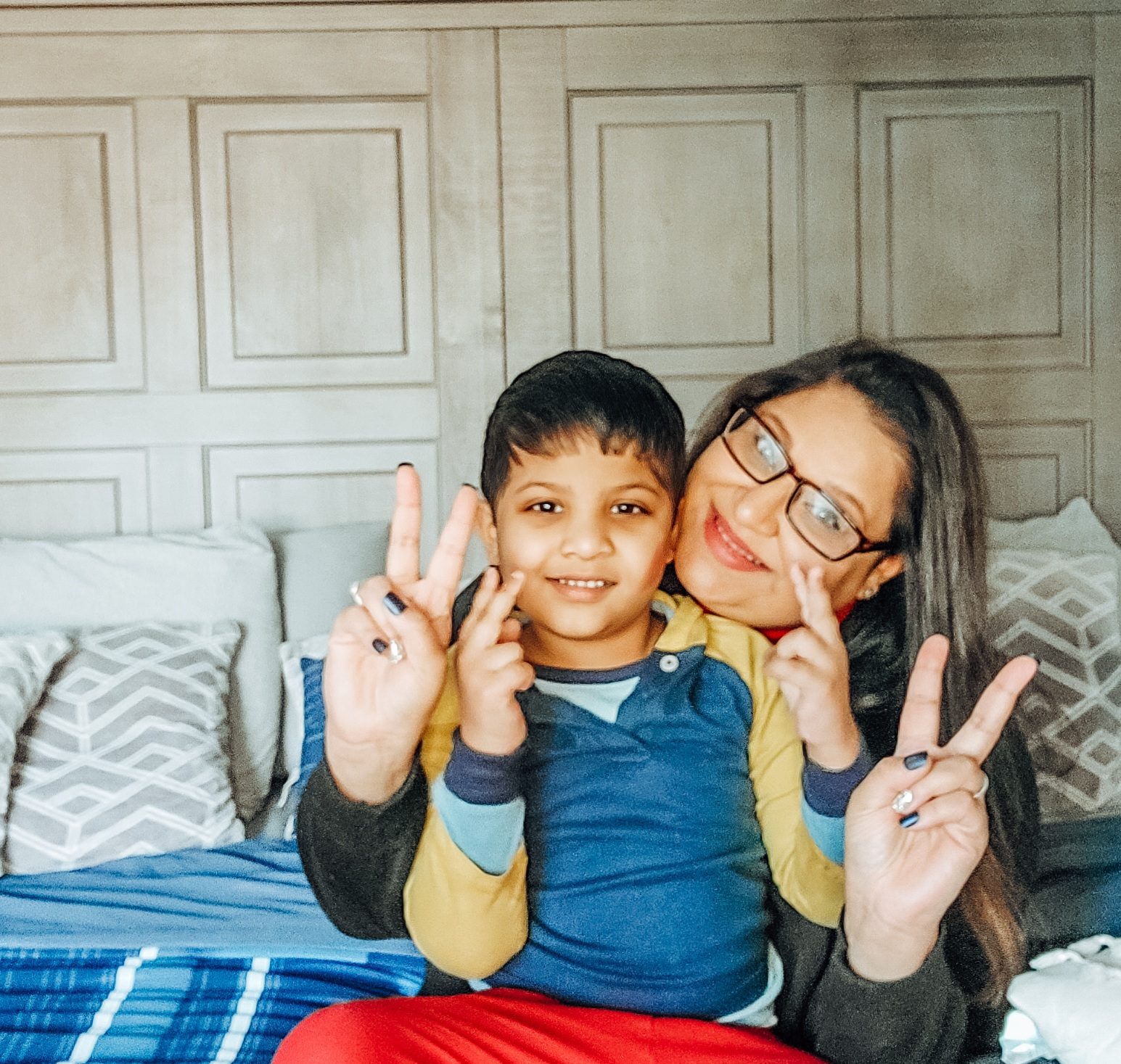 Me and my son holding peace signs up